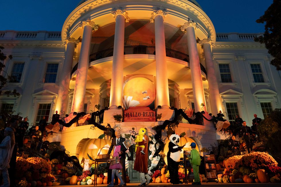 The White House is seen decorated for Halloween as the Bidens hand out candy and books
