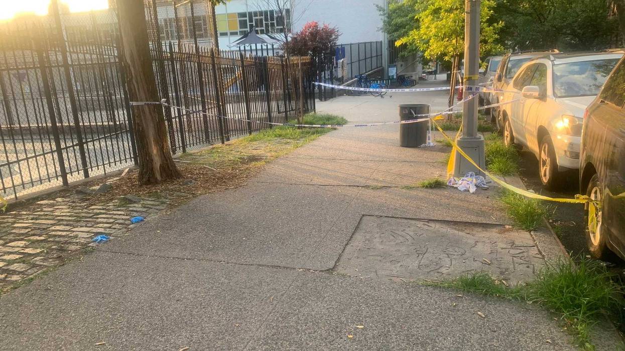 The woman was shot in the head at Lexington Avenue and East 95th Street around 8:30 p.m. The scene was still active Thursday morning