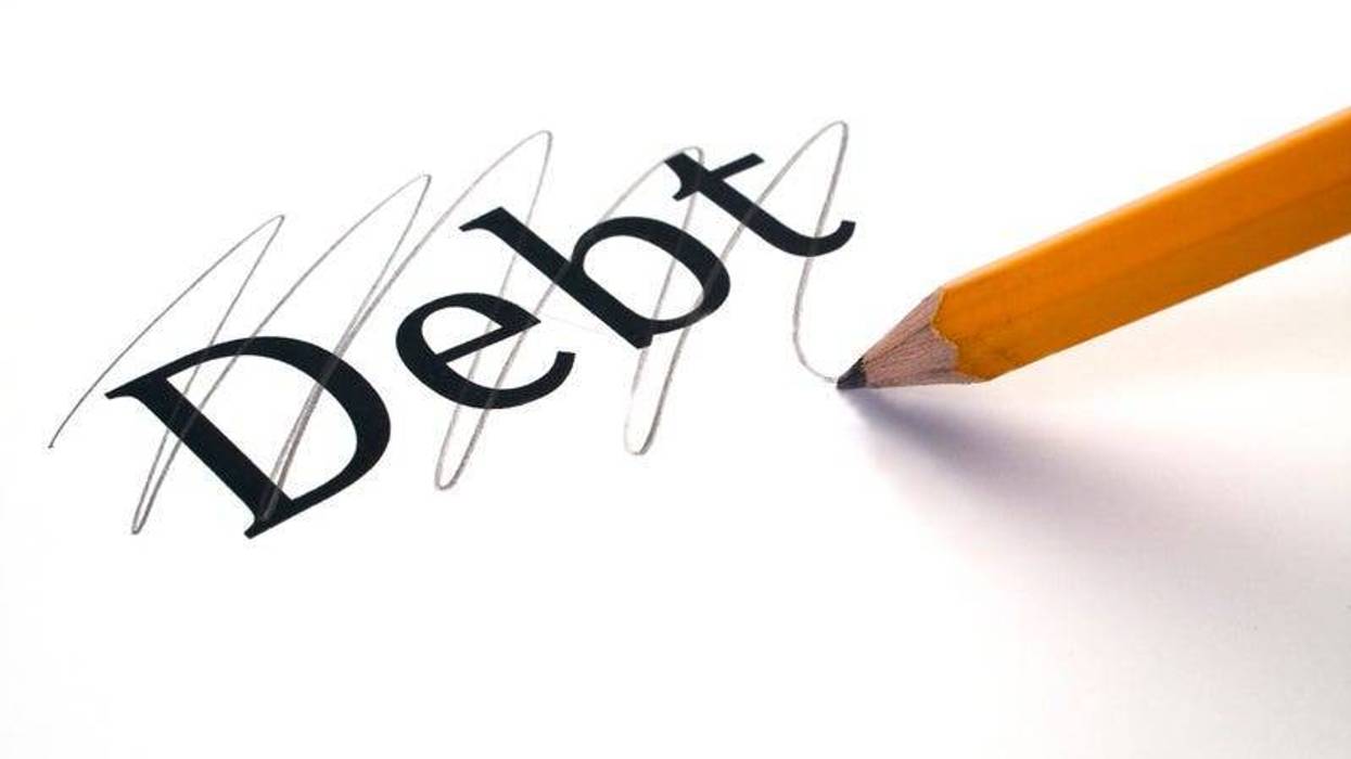The word debt marked through, yellow pencil