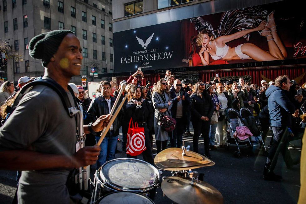 The worker was apparently removing this billboard of Gigi Hadid when he was knocked from the lift outside the flagship Victoria