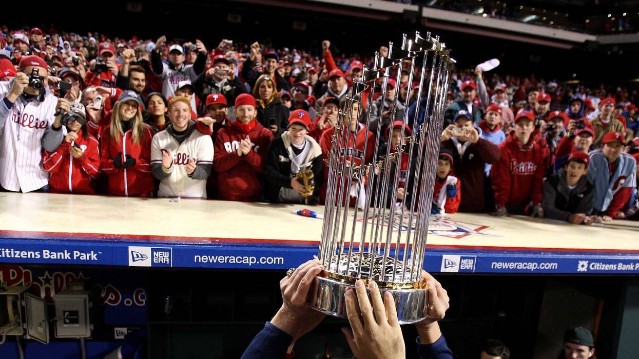 The World Series championship trophy is held up in front of fans of the Philadelphia Phillies after they won 4-3 against the Tampa Bay Rays during the continuation of game five of the 2008 MLB World Series on Oct. 29, 2008, at Citizens Bank Park in Philadelphia, Pennsylvania.