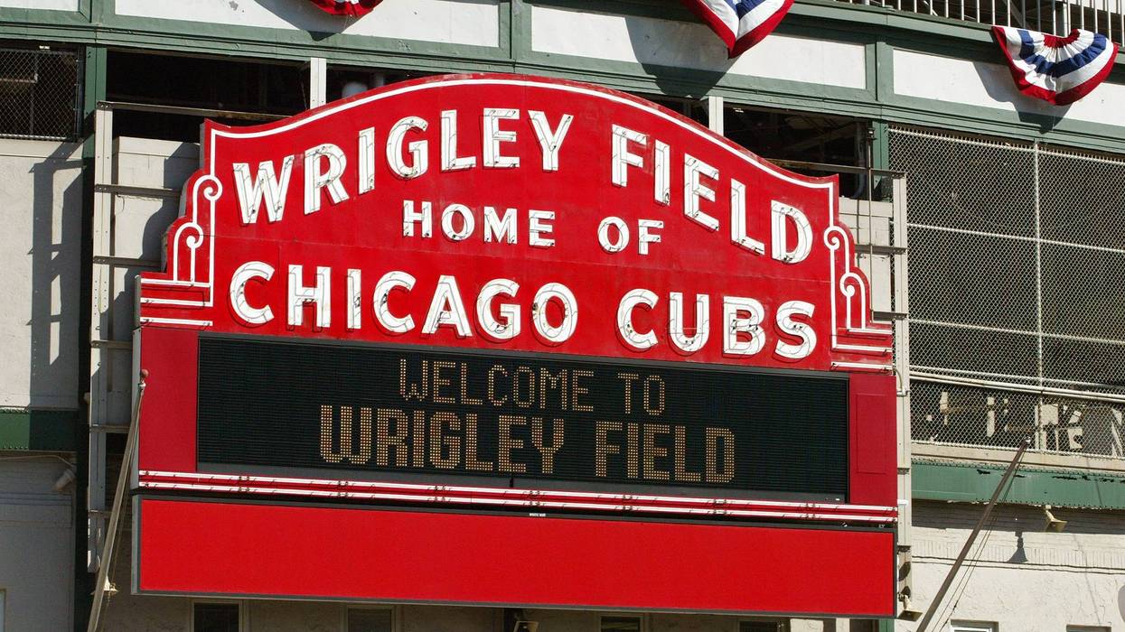 The "Wrigley Field Home Of The Chicago Cubs" marquee is visible October 13, 2003 Chicago, Illinois.