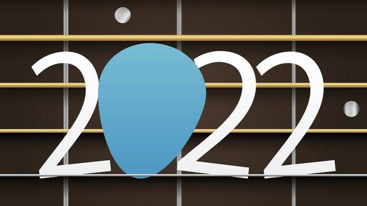 The year 2022 superimposed on guitar strings