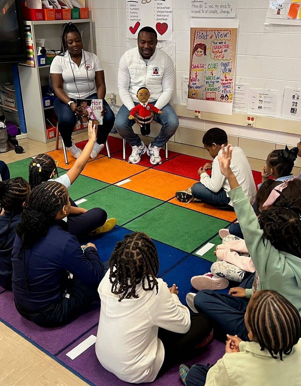 Their first joint book reading to second graders at John T. Pirie Fine Arts and Academic Center on the Southside was a hit with students, teachers and faculty. The featured book was "Hair Love" by Matthew A. Cherry.