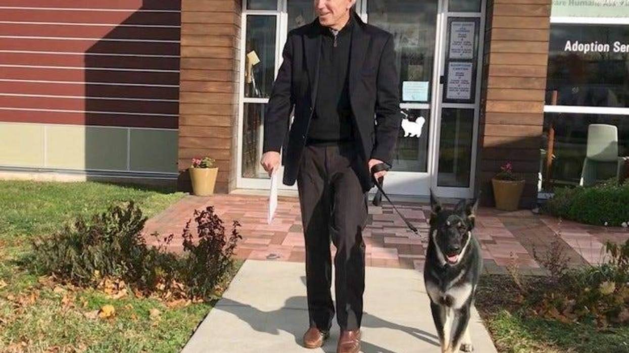 Then-President-elect Joe Biden leaves a Delaware shelter with rescue dog Major.