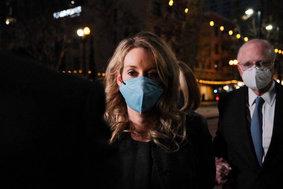 Theranos founder and former CEO Elizabeth Holmes and her lawyer leave the Robert F. Peckham Federal Building on January 3, 2022 in San Jose, California.