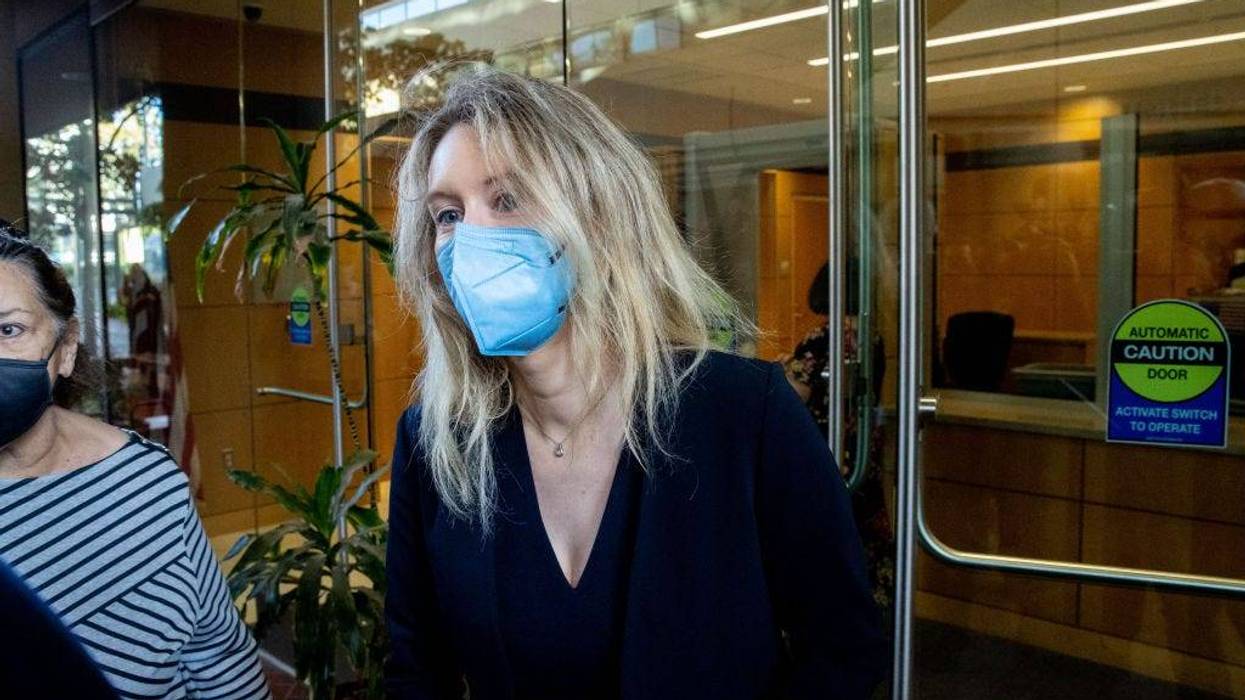 Theranos founder Elizabeth Holmes arrives at the Robert F. Peckham Federal Building with her defense team on August 31, 2021 in San Jose, California.
