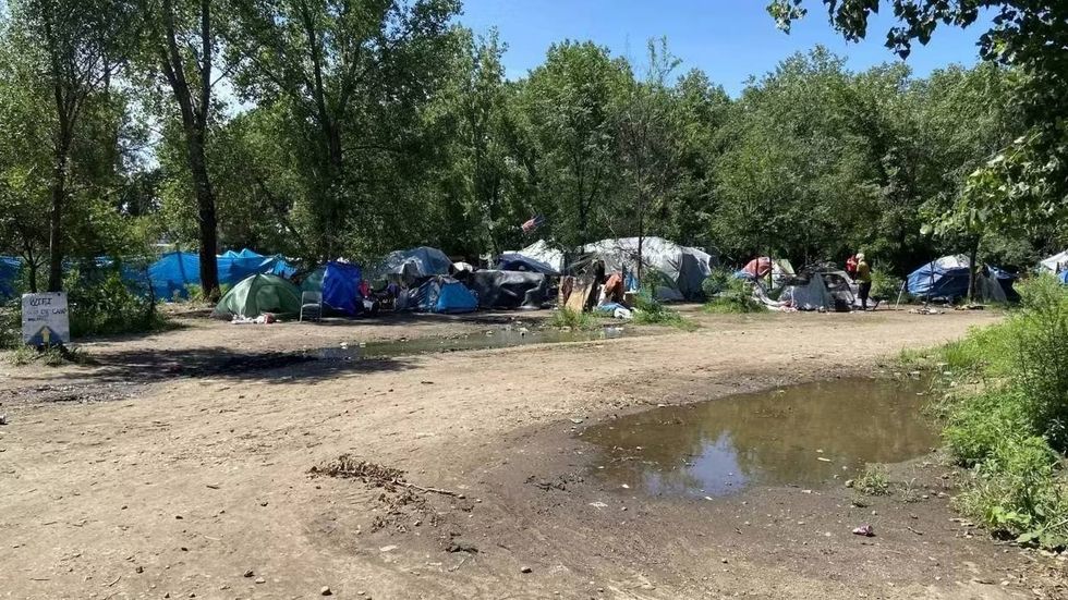 There's no word of serious injuries after fire destroys part of St. Paul homeless encampment