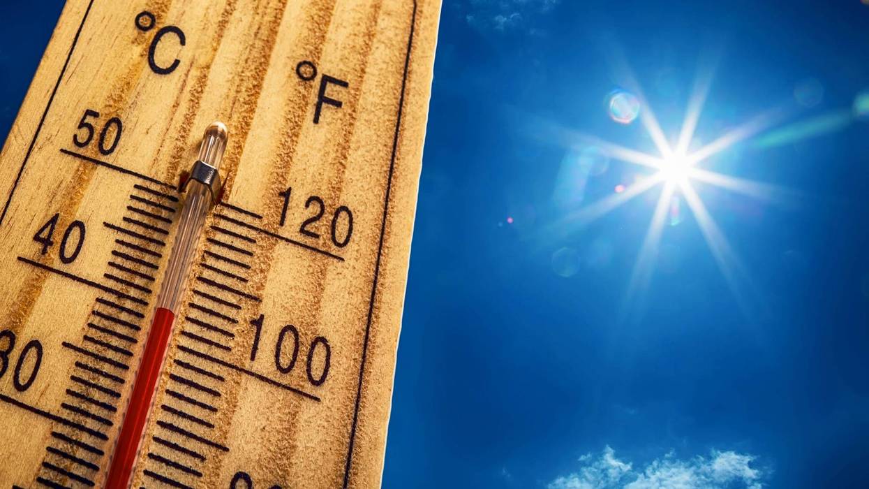 Thermometer Sun Sky 40 Degres. Hot summer day. High Summer temperatures in degrees Celsius and Farenheit.