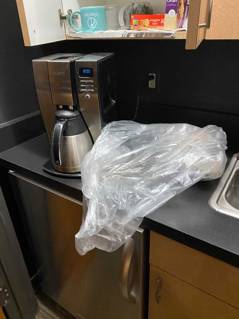 They left this garbage bag with GARBAGE in it next to our coffee pot. Gross.