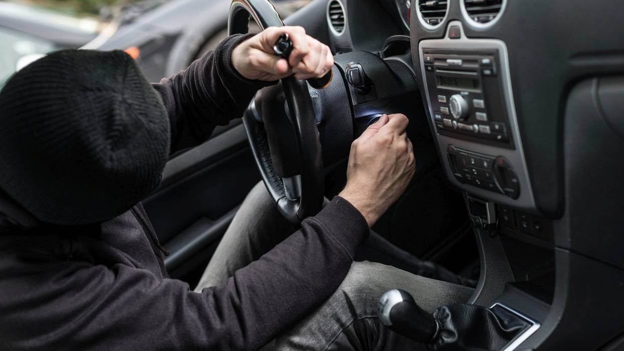Thief stealing car