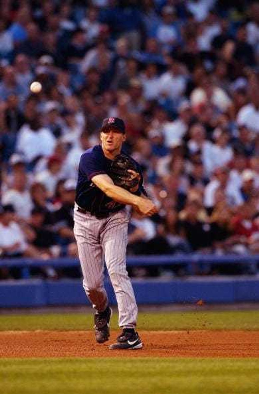 Third baseman Corey Koskie #47 of the Minnesota Twins throws to first base during the American League game against the Chicago White Sox at U.S. Cellular Field on July 2, 2003 in Chicago, Illinois.