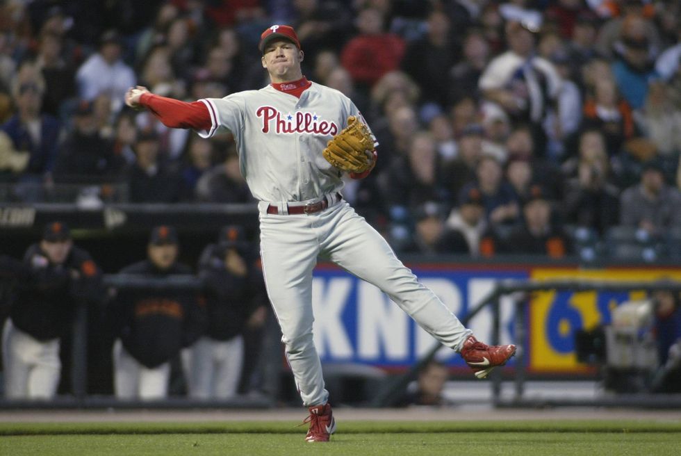 Third Baseman Scott Rolen of the Philadelphia Phillies throws the ball to first base against the San Francisco Giants during the game on April 29, 2002 at Pac Bell Park in San Francisco, California. The Giants won the game 8-5.