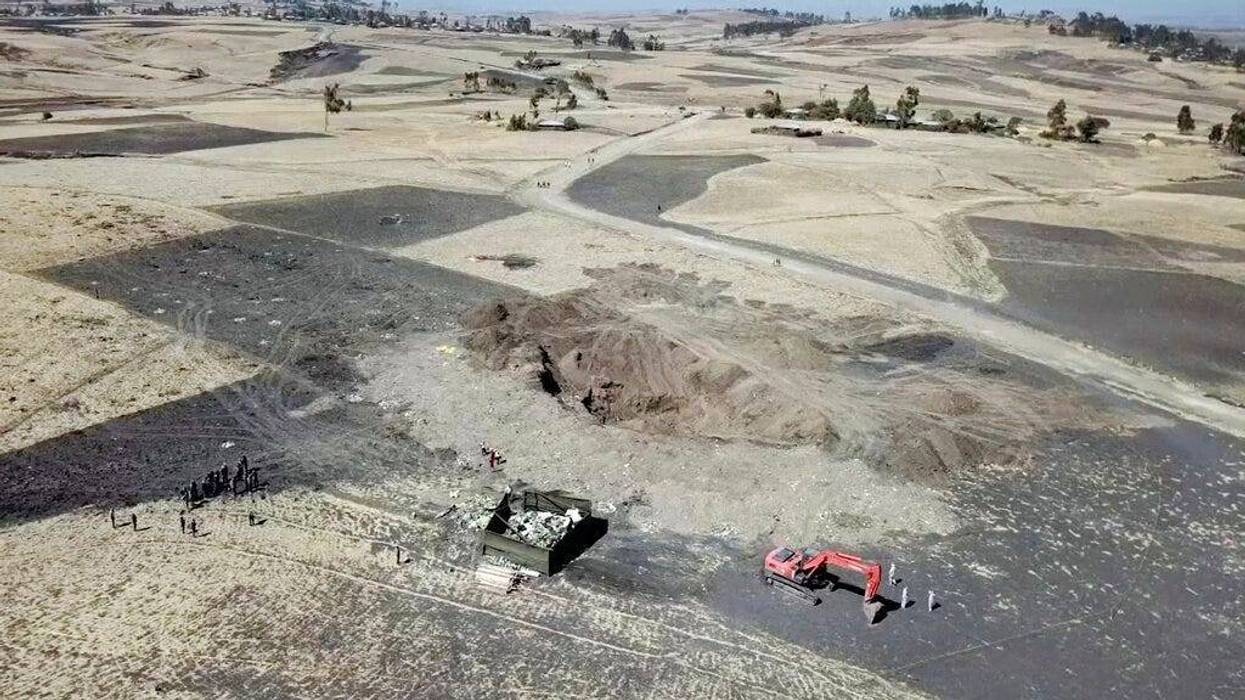 This aerial image made from video shows recovery work continuing at the scene where the Ethiopian Airlines Boeing 737 Max 8 crashed shortly after takeoff on Sunday killing all 157 on board,