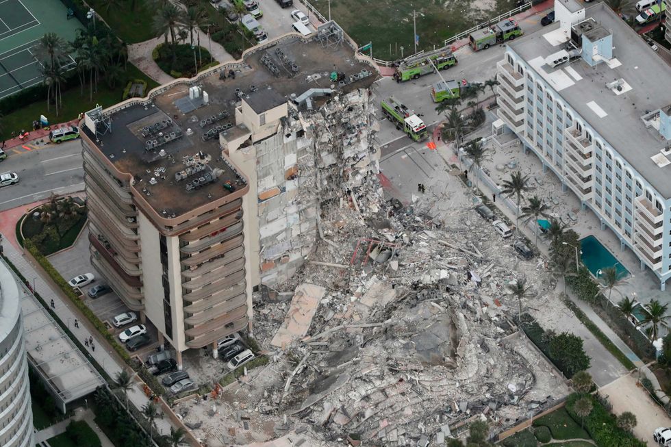 This aerial photo shows part of the 12-story oceanfront Champlain Towers South Condo that collapsed early Thursday, June 24, 2021 in Surfside, Fla