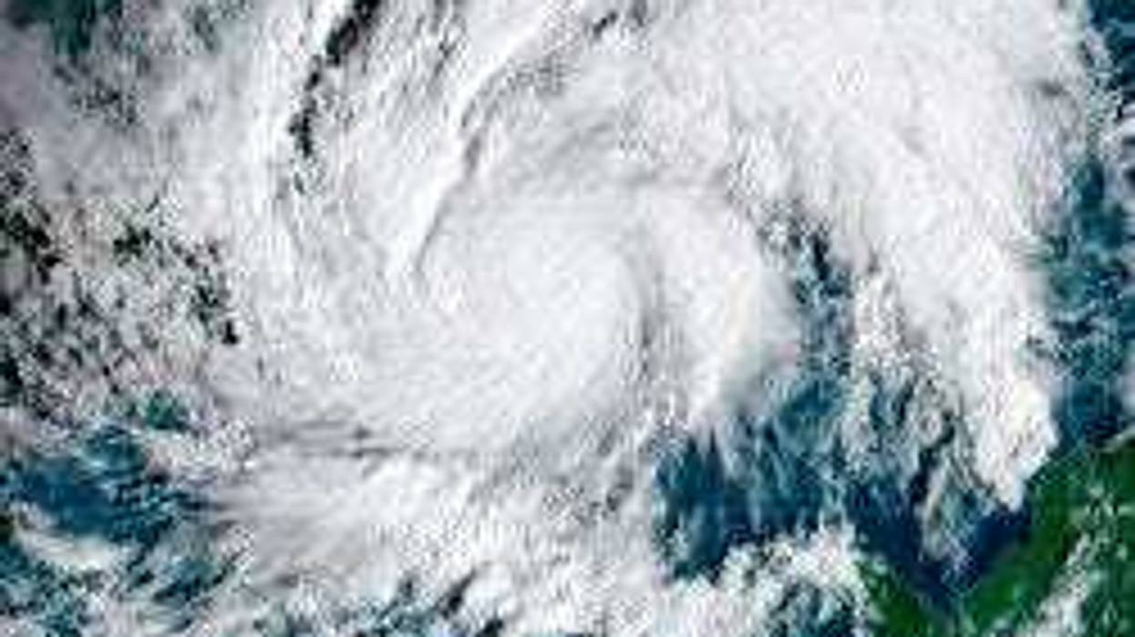 This GeoColor satellite image taken Tuesday, Nov. 3, 2020, and provided by NOAA, shows Hurricane Eta in the Caribbean Sea, arriving at Nicaragua's northern shore. Eta inched closer on Tuesday as a Category 4 storm. (NOAA via AP)