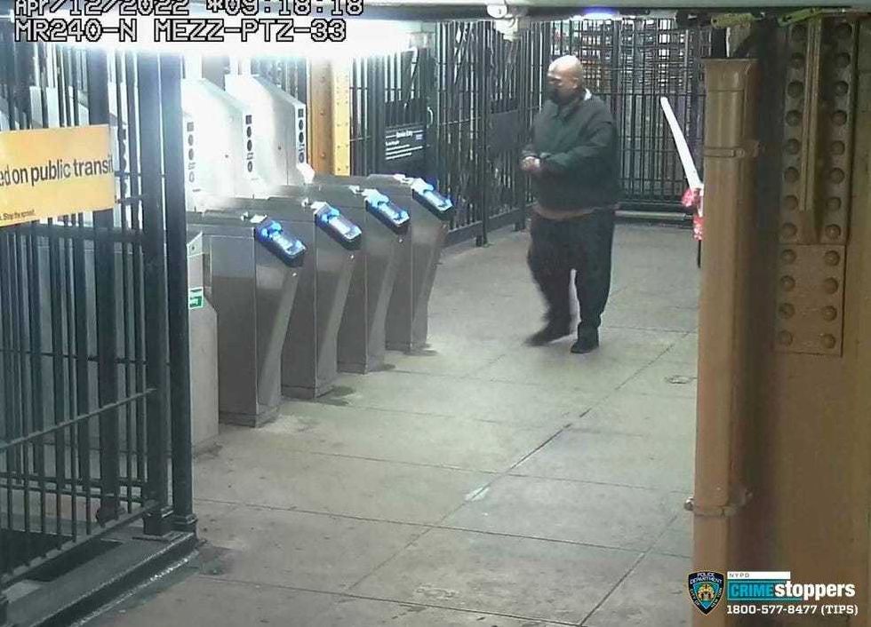 This image provided by New York Police Department on Wednesday, April 13, 2022, shows suspected subway shooter Frank R. James, 62, leaving a subway station after his attack on a subway train Tuesday
