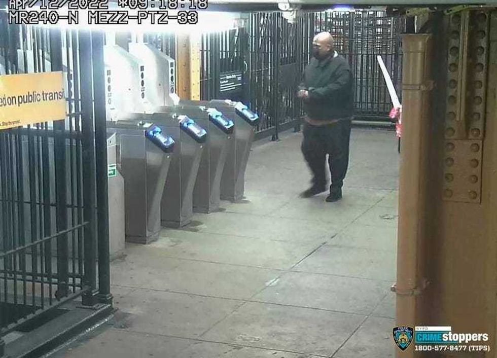 This image provided by the NYPD shows suspected subway shooter Frank R. James, 62, leaving a subway station on April 12, 2022