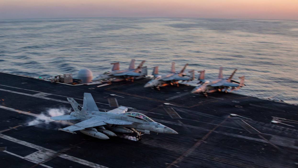 This image provided by U.S. Central Command shows a F/A-18F Super Hornet preparing to make an arrested landing on the USS Abraham Lincoln (CVN 72)) in support of Operation Epic Fury, on Saturday, Feb. 28, 2026.