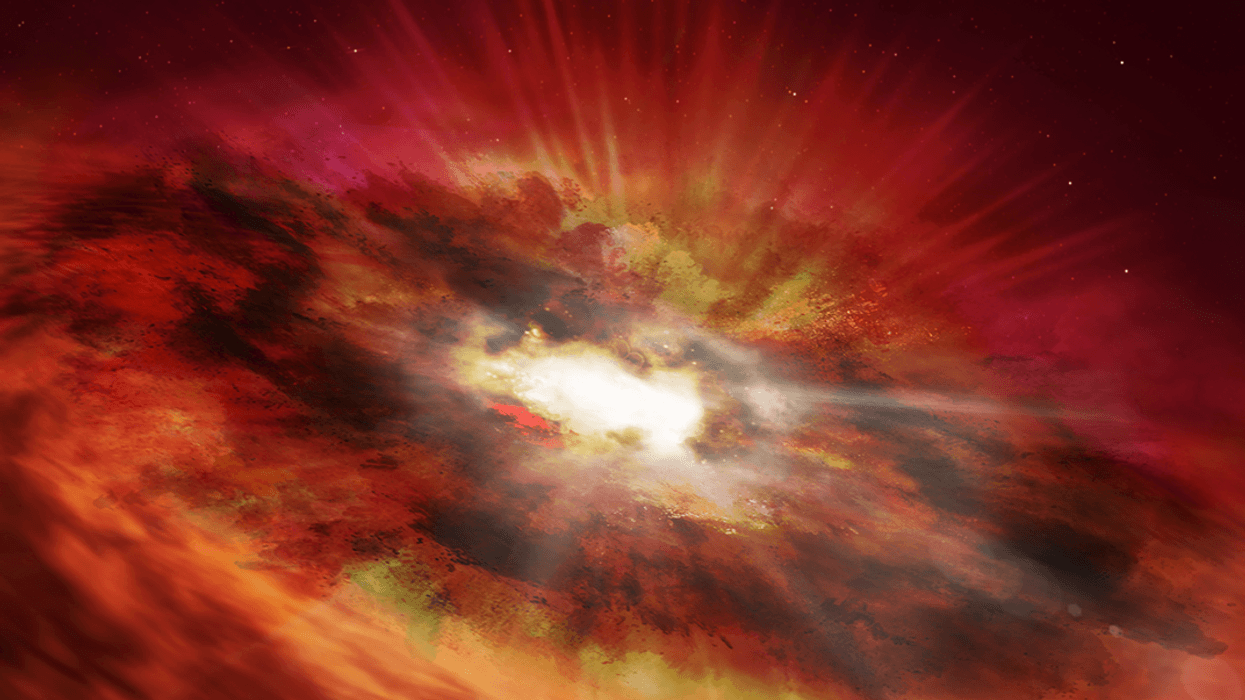 This is an artist's illustration of a supermassive black hole that is inside the dust-shrouded core of a vigorously star-forming "starburst" galaxy.