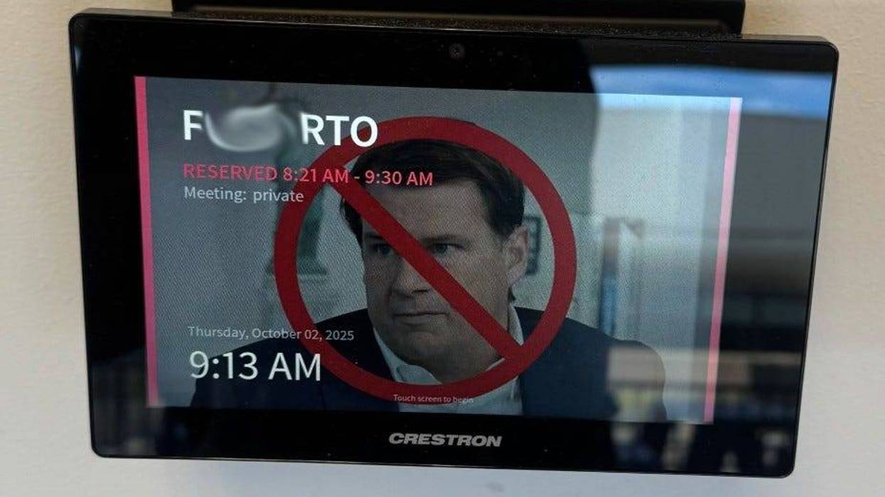 This photo of a message on a screen at Ford in Dearborn has been blurred to obscure profanity.