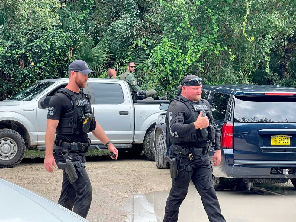 This photo provided by North Port Police Department, law enforcement officials conduct a search of the vast Carlton Reserve in the Sarasota, Fla., area for Brian Laundrie on Saturday, Sept. 18, 2021