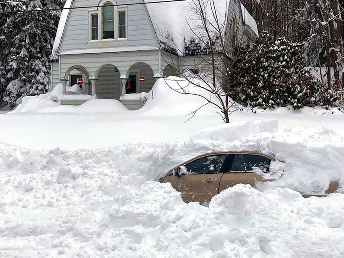 This photo, provided by the New York State Police, shows a car, in Owego, NY, from which a New York State Police sergeant rescued Kevin Kresen, 58, of Candor, NY, stranded for 10 hours