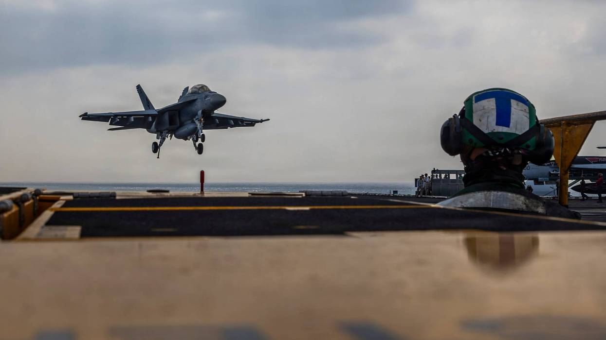This photo provided by the U.S. Navy shows a Boeing F/A-18E Super Hornet landing on the Nimitz-class aircraft carrier USS Abraham Lincoln in the Indian Ocean on Jan. 22, 2026.