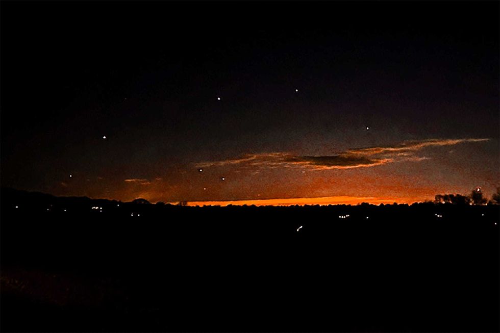 This photo provided by Trisha Bushey shows the evening sky and points of light near in Lebanon Township, N.J., on Thursday, Dec. 5, 2024