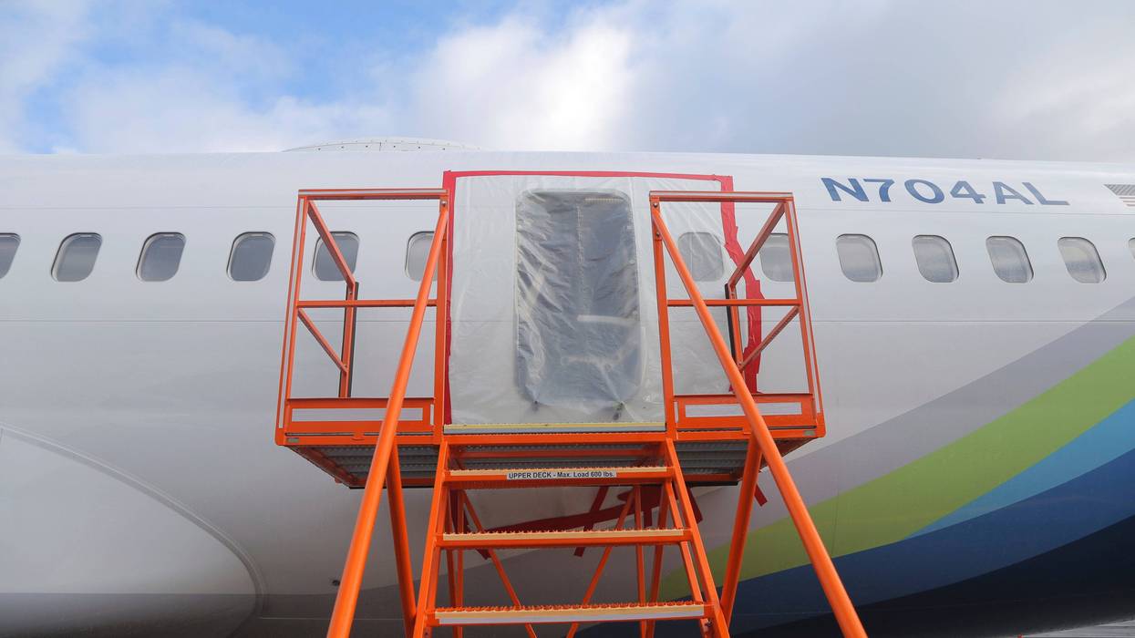 This photo released by the National Transportation Safety Board shows a gaping hole where the paneled-over door had been at the fuselage plug area of Alaska Airlines Flight 1282 on Sunday, Jan. 7, 2024, in Portland, Ore. A panel used to plug an area reserved for an exit door on the Boeing 737 Max 9 jetliner blew out Jan. 5, shortly after the flight took off from Portland, forcing the plane to return to Portland International Airport.