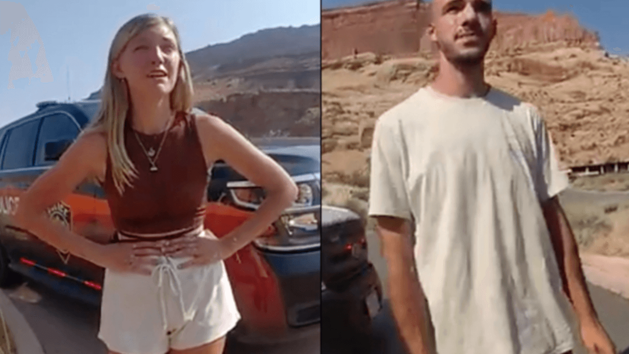 This police camera image provided by The Moab Police Department shows Gabby Petito and Brian Laundrie talking with officers after police pulled over the van they were traveling in near the entrance to Arches National Park on Aug. 12, 2021.