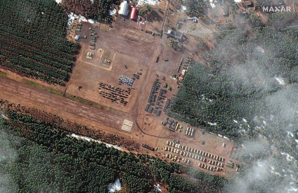 This Tuesday, Feb. 22, 2022 satellite imagery provided by Maxar Technologies shows new deployments of troops and equipment that have been established in rural areas southwest of Belgorod, less than 20 kilometers to the northwest of the border with Ukraine