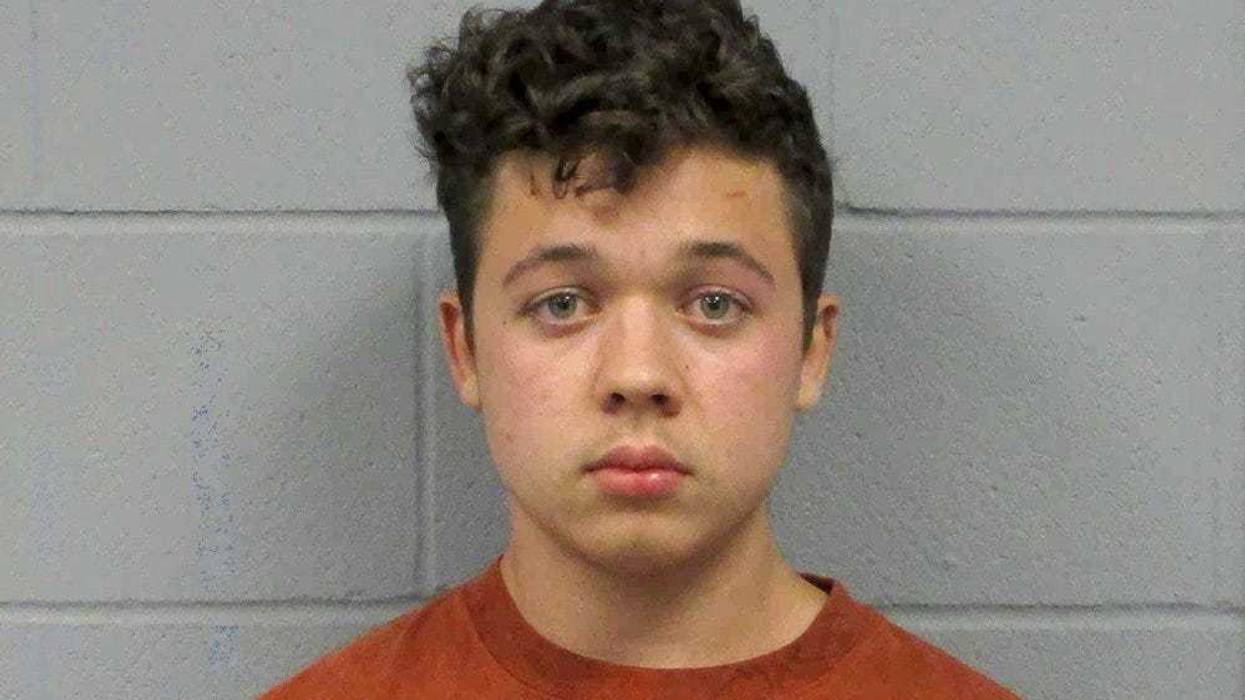 This undated booking photo from the Antioch, Ill., Police Department shows Kyle Rittenhouse. Prosecutors asked a judge Wednesday, Feb. 3, 20201, for a new arrest warrant for Rittenhouse, the Illinois teen charged with shooting three people, killing two of them, during a protest over police brutality in Wisconsin, after he apparently violated his bail conditions.