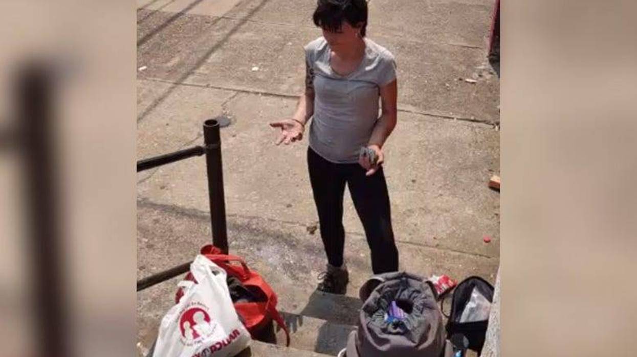 This woman assaulted a business owner with a chemical spray when she was asked to leave then premises, say police.