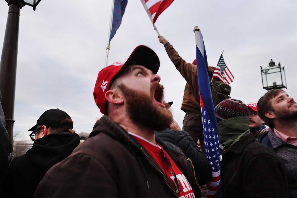 Thousands of Donald Trump supporters storm the United States Capitol building following a "Stop the Steal" rally on January 06, 2021 in Washington, DC. The protesters stormed the historic building, breaking windows and clashing with police. Trump supporters had gathered in the nation