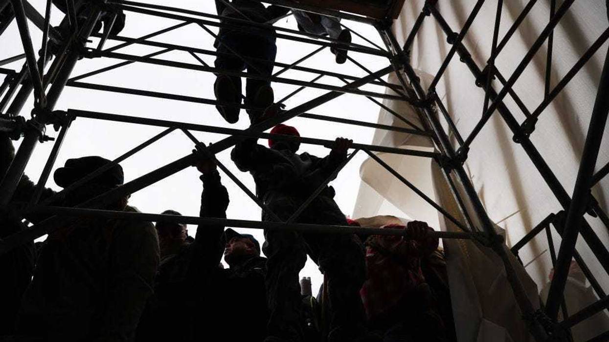 Thousands of Donald Trump supporters storm the United States Capitol building following a "Stop the Steal" rally on January 06, 2021.