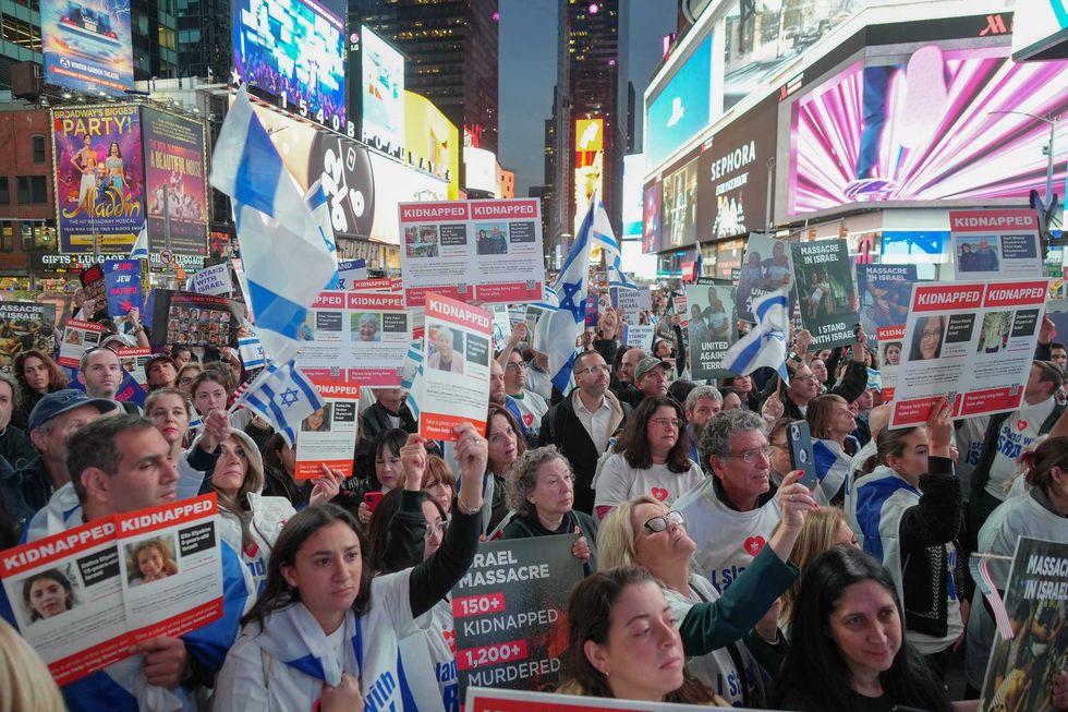 Thousands of people gathered for rally organized by IAC (Israeli American Council) on Times Square demanding return of all hostages taken by Hamas during their terrorist attack on Israel. Photos of the kidnapped were displayed on billboards around Times Square on Oct. 19, 2023.