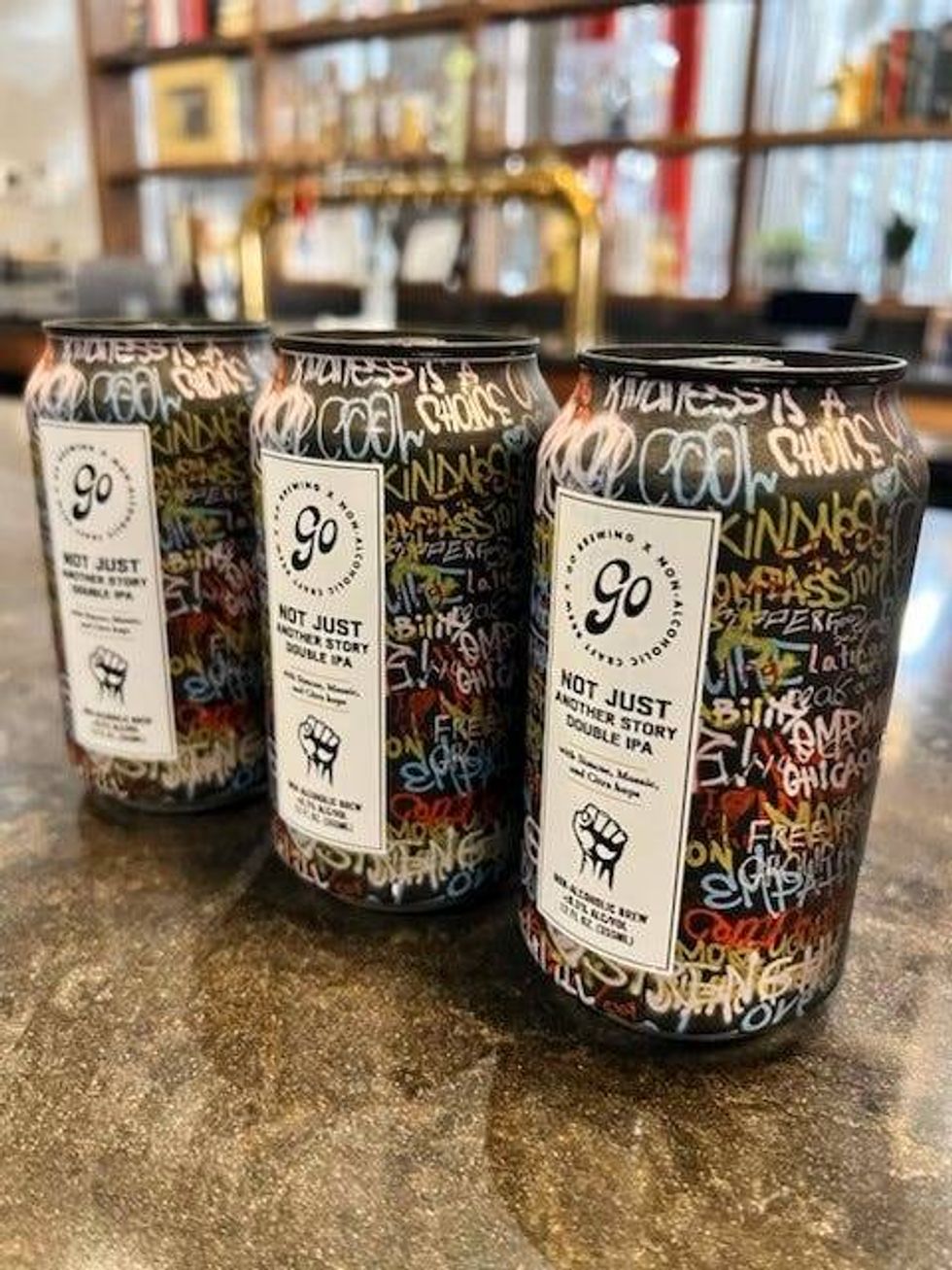 Three cans of Go Brewing non-alcoholic beer cans