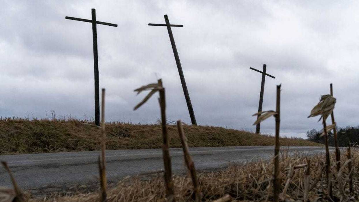 Three crosses stand on a hillside overlooking a farm on the state line of Ohio and Pennsylvania following a train derailment prompting health concerns on February 17, 2023 in East Palestine, Ohio. On February 3rd, a Norfolk Southern Railways train carrying toxic chemicals derailed causing an environmental disaster. Thousands of residents were ordered to evacuate. (Photo by Michael Swensen/Getty Images)