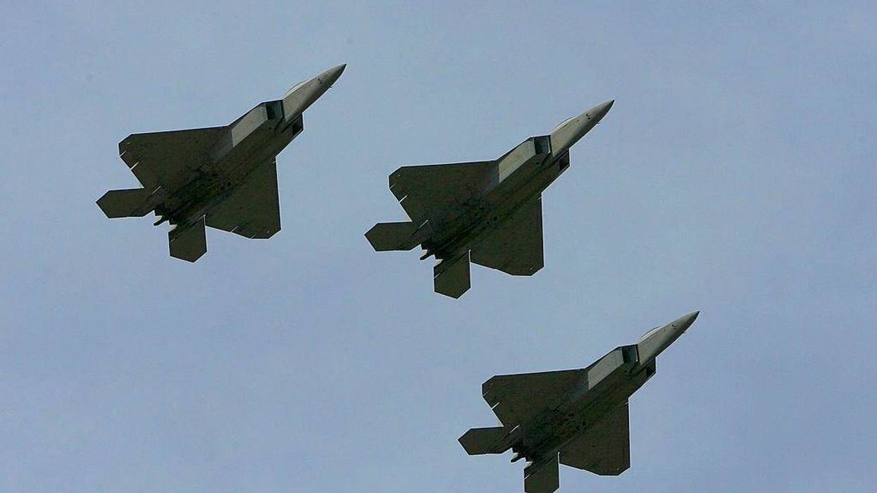 Three F-22 Raptors, fly over the track during pre-race ceremonies prior to the NASCAR Nextel Cup Series Coca-Cola 600 on May 27, 2007 at Lowe's Motor Speedway in Concord, North Carolina