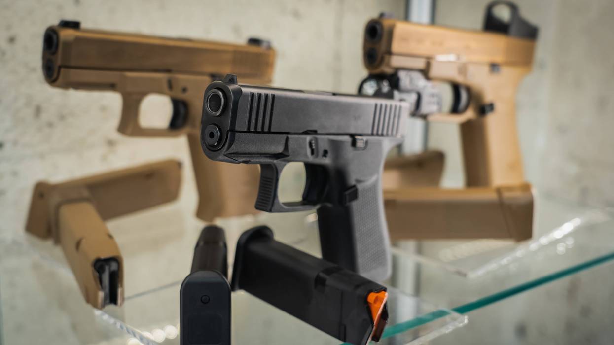 Three guns in a display case