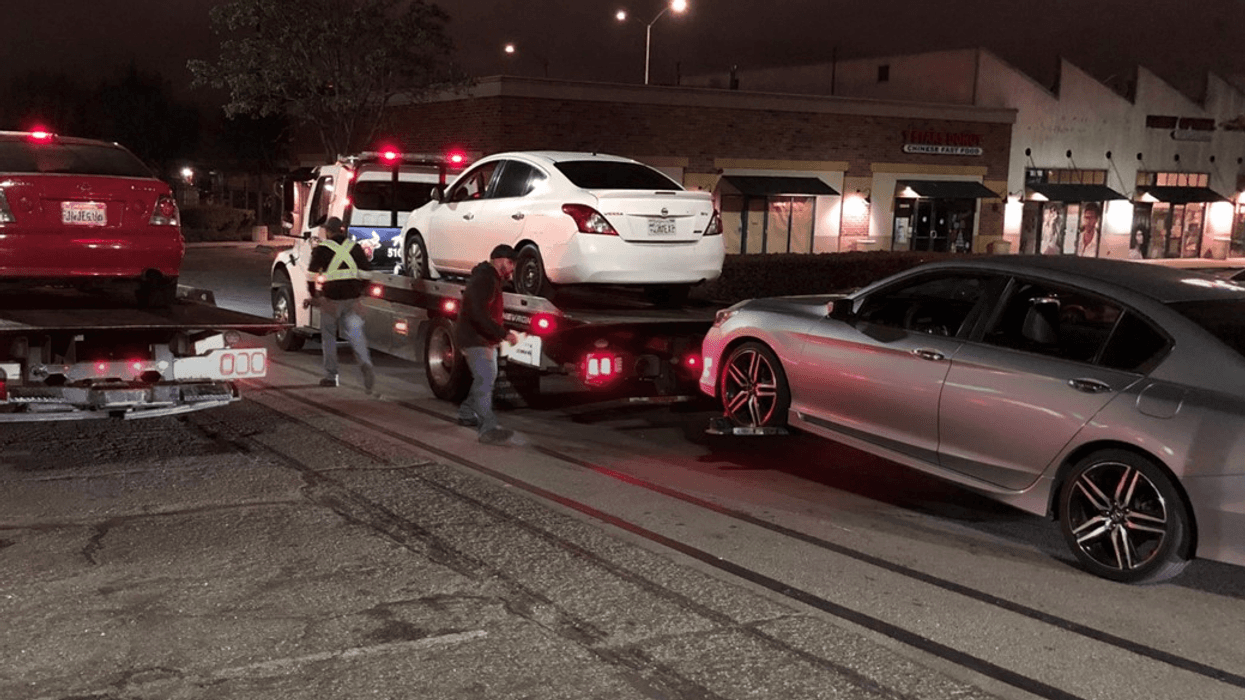 Three of 60 vehicles towed by Oakland police on Friday morning.