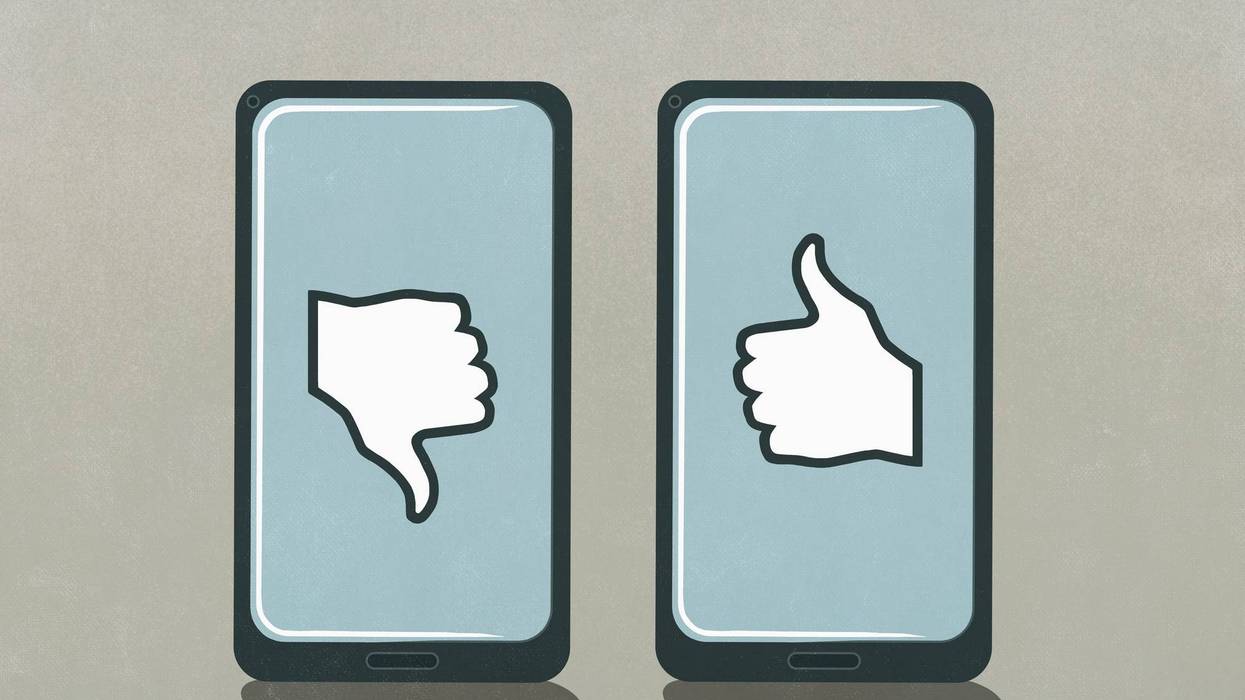 Thumbs up and thumbs down symbols on smart phone screens