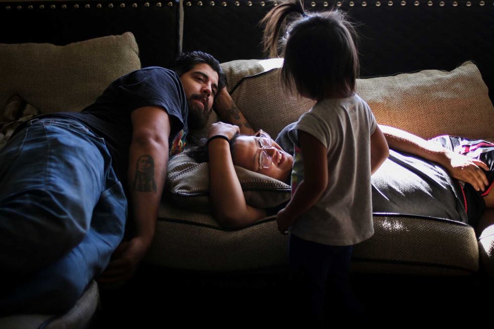 Tiana Antoine and Nathan Drennan relax with their niece. Flathead Indian Reservation, Montana