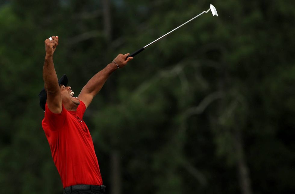 Tiger Woods celebrates after sinking the winning putt at the 2019 Masters