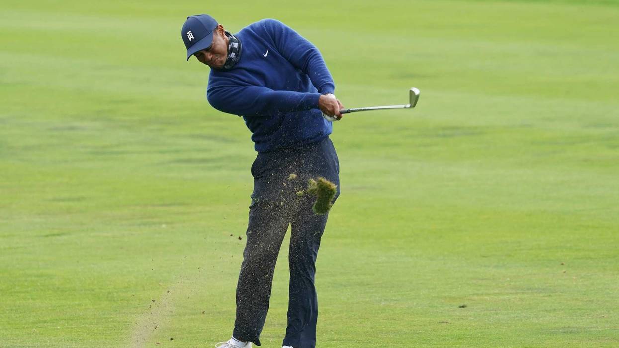 Tiger Woods hits from the fairway on the 13th hole during the first round of the 2020 PGA Championship golf tournament at TPC Harding Park.