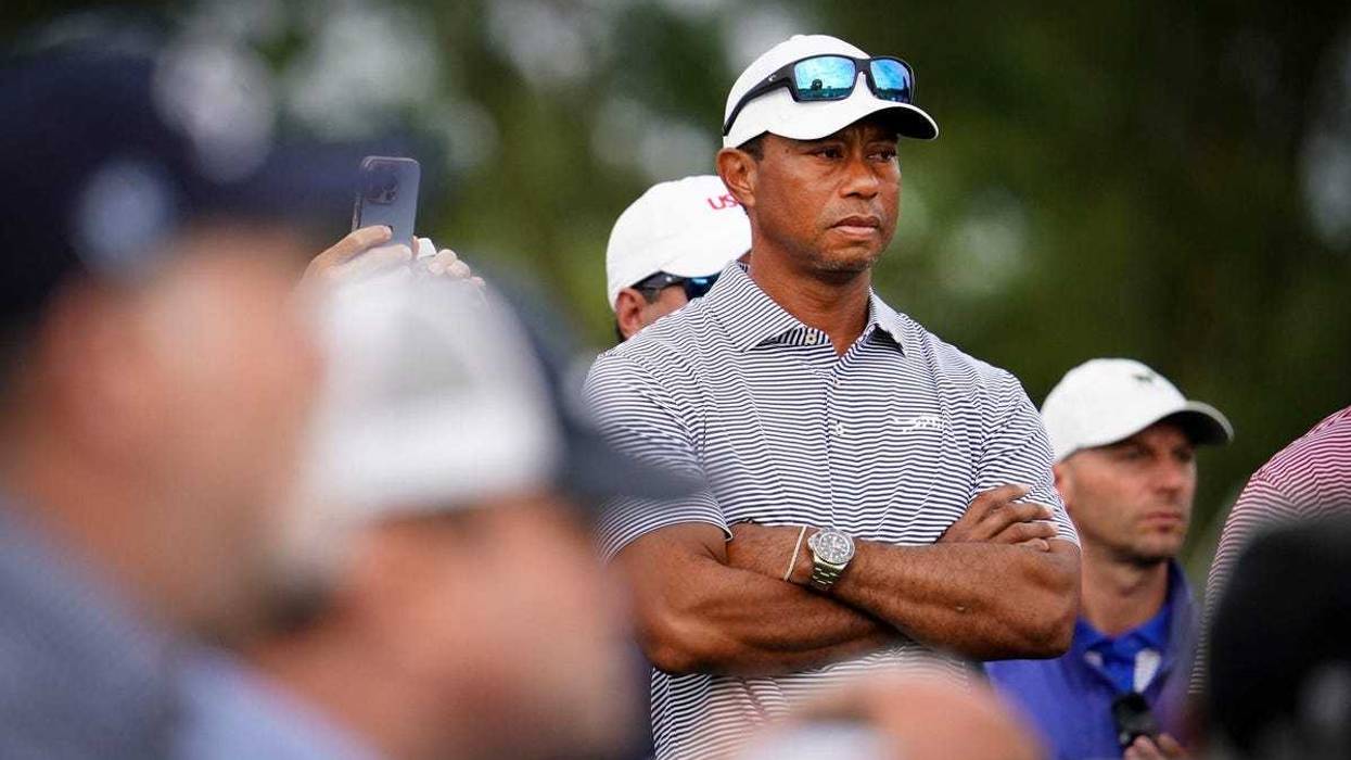 Tiger Woods watches his son Charlie tee off from No. 1 on the North Course during the 76th U.S. Junior Amateur Championship at Oakland Hills Country Club in Bloomfield Hills on Monday, July 22, 2024.