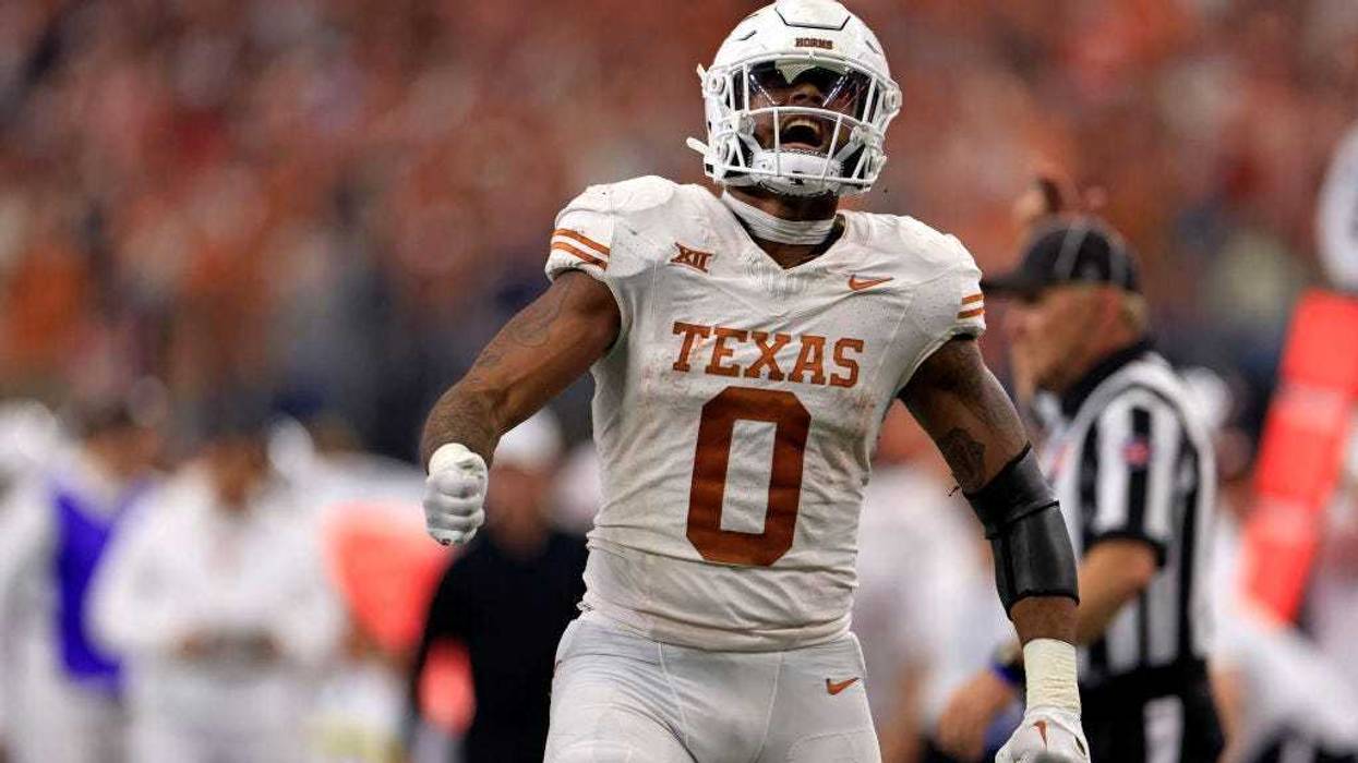 Tight end Ja'Tavion Sanders #0 of the Texas Longhorns celebrates after a first down against the Oklahoma State Cowboys in the first half of the Big 12 Championship at AT&T Stadium on December 2, 2023 in Arlington, Texas.