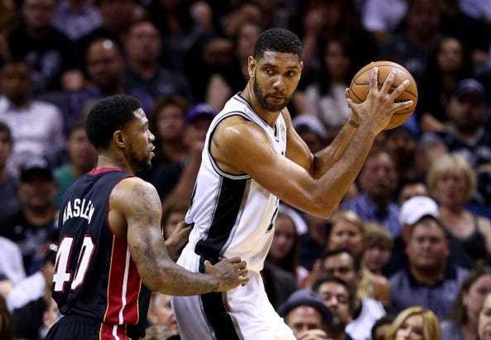 Tim Duncan backs down Udonis Haslem in the NBA Finals.