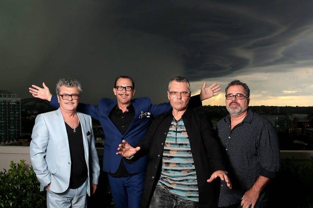 Tim Farriss, Kirk Pengilly, Jon Farriss and Andrew Farriss of INXS pose at the special Quadruple Platinum plaque presentation